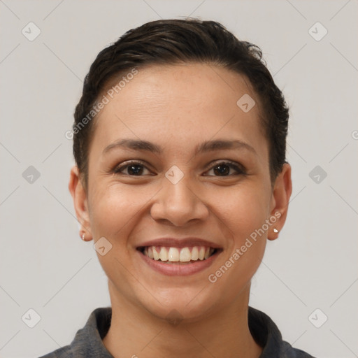Joyful white young-adult female with short  brown hair and brown eyes