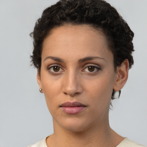 Neutral white young-adult female with short  brown hair and brown eyes