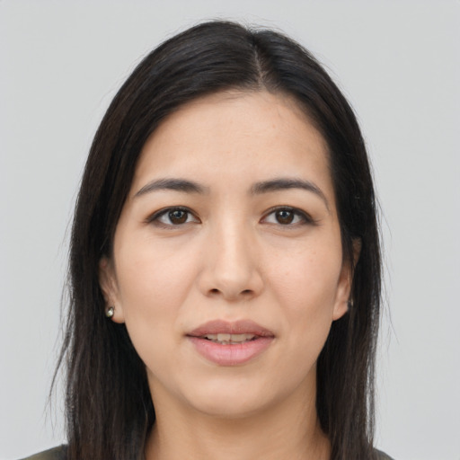 Joyful asian young-adult female with long  brown hair and brown eyes