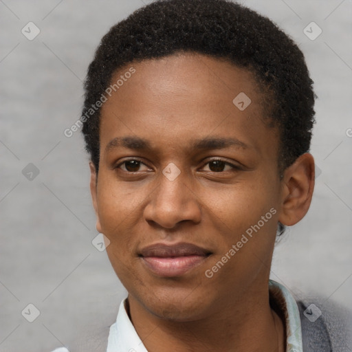 Joyful black young-adult female with short  brown hair and brown eyes