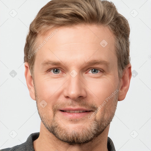 Joyful white adult male with short  brown hair and grey eyes