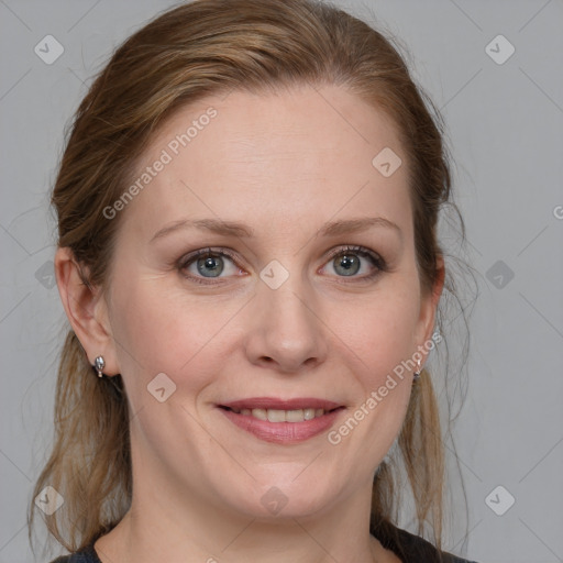 Joyful white adult female with medium  brown hair and blue eyes