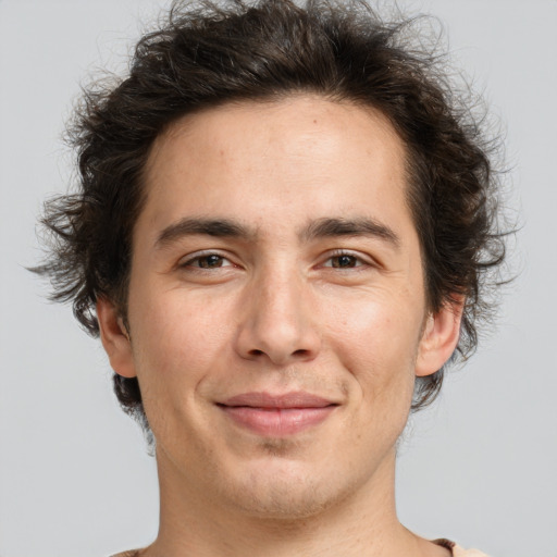 Joyful white adult male with medium  brown hair and brown eyes