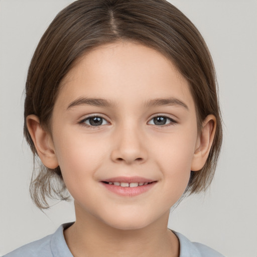 Joyful white child female with medium  brown hair and brown eyes