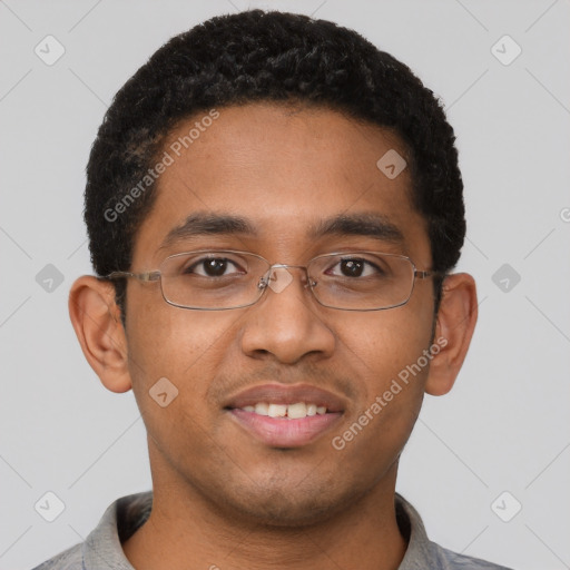 Joyful latino young-adult male with short  brown hair and brown eyes