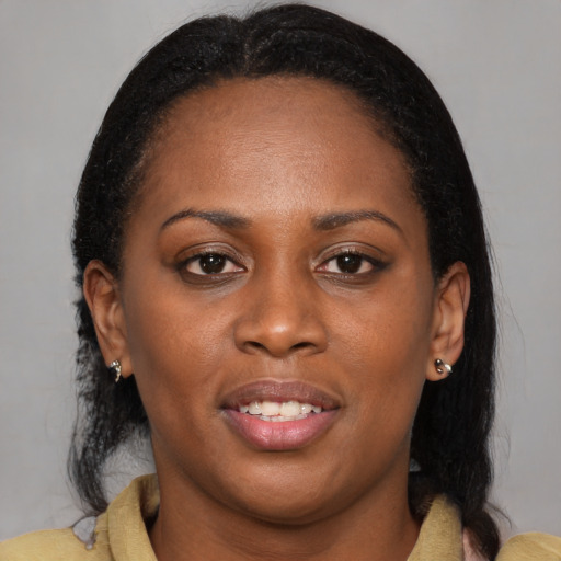 Joyful black young-adult female with medium  brown hair and brown eyes