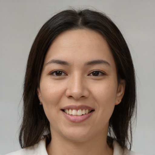 Joyful white young-adult female with medium  brown hair and brown eyes