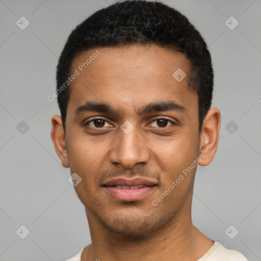 Joyful black young-adult male with short  black hair and brown eyes