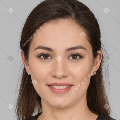 Joyful white young-adult female with long  brown hair and brown eyes