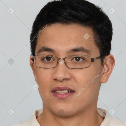 Joyful asian young-adult male with short  brown hair and brown eyes