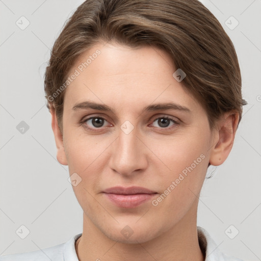 Joyful white young-adult female with short  brown hair and grey eyes