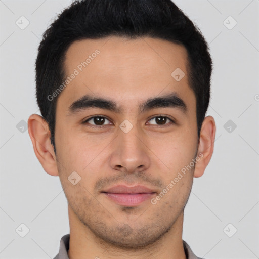 Joyful latino young-adult male with short  brown hair and brown eyes