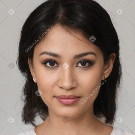 Joyful latino young-adult female with medium  brown hair and brown eyes