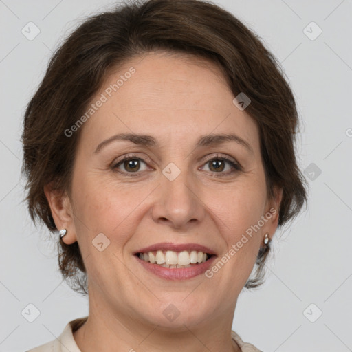 Joyful white adult female with medium  brown hair and green eyes