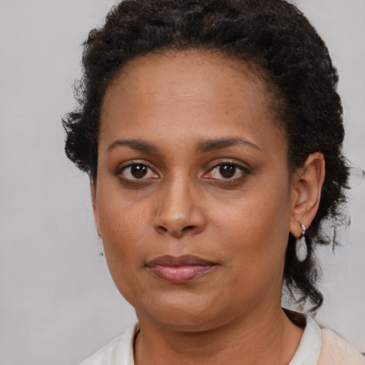Neutral black young-adult female with short  brown hair and brown eyes