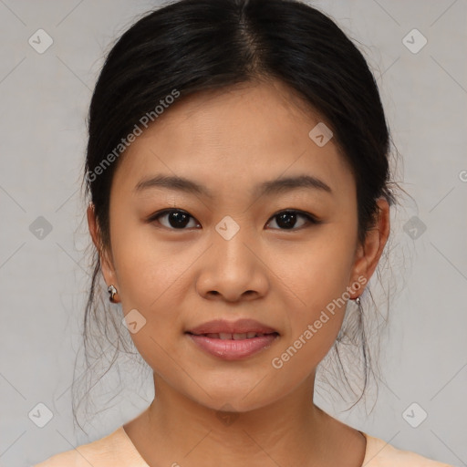 Joyful asian young-adult female with medium  brown hair and brown eyes