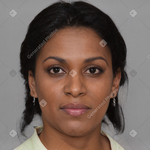 Joyful black adult female with medium  brown hair and brown eyes