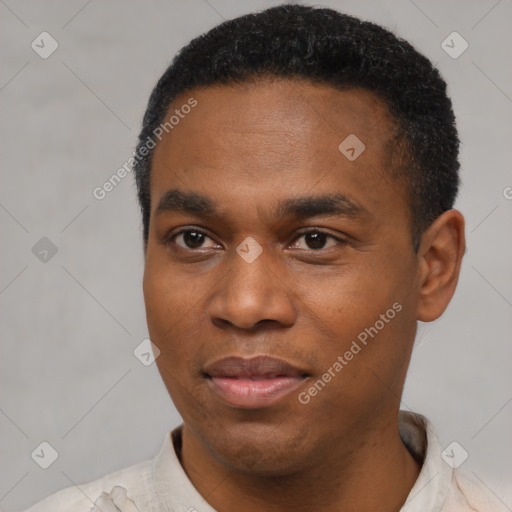 Joyful black young-adult male with short  black hair and brown eyes