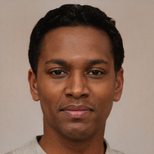 Neutral black young-adult male with short  black hair and brown eyes
