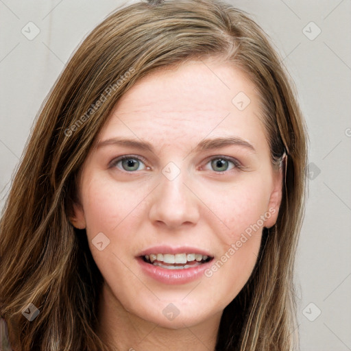 Joyful white young-adult female with long  brown hair and blue eyes