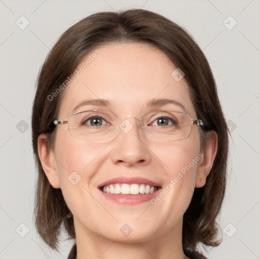 Joyful white adult female with medium  brown hair and grey eyes