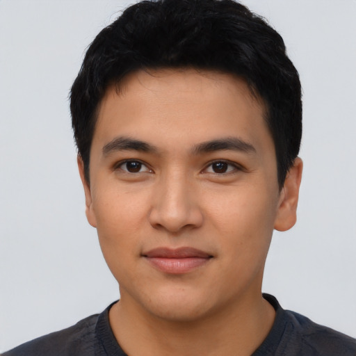 Joyful asian young-adult male with short  black hair and brown eyes