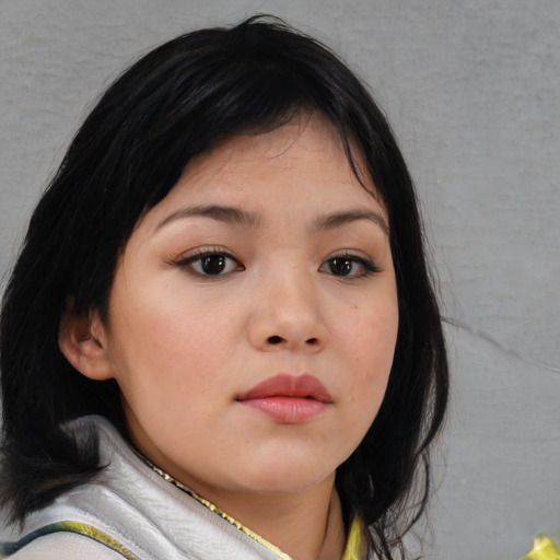 Neutral asian child female with medium  brown hair and brown eyes