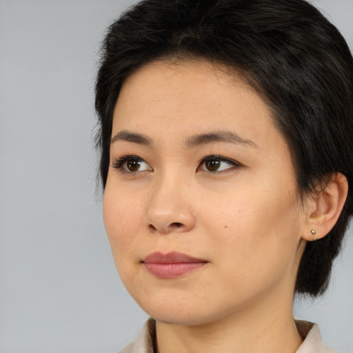 Neutral asian young-adult female with medium  brown hair and brown eyes
