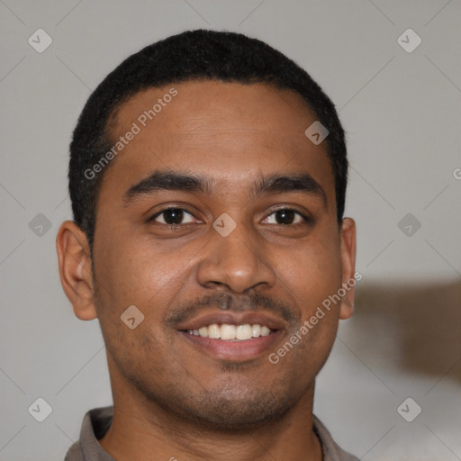 Joyful black young-adult male with short  black hair and brown eyes