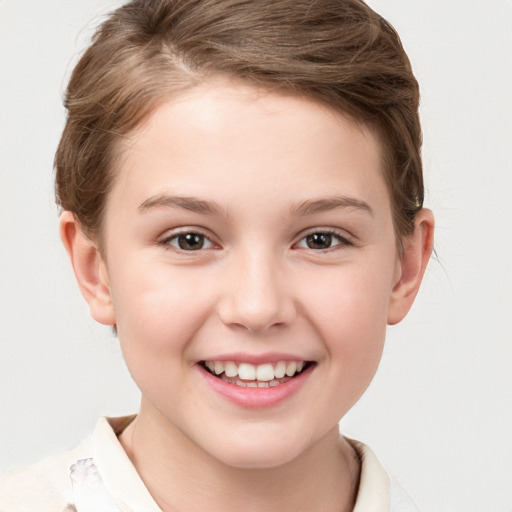 Joyful white child female with short  brown hair and brown eyes