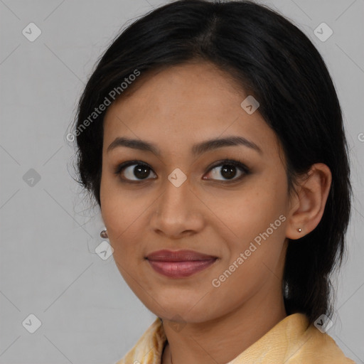 Joyful latino young-adult female with medium  brown hair and brown eyes