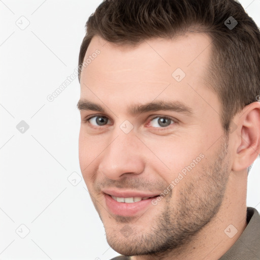 Joyful white young-adult male with short  brown hair and brown eyes