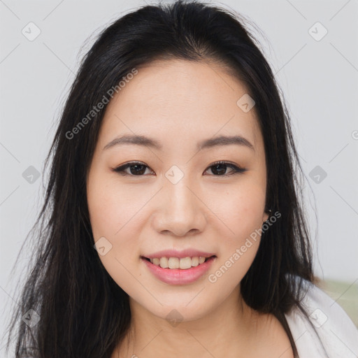 Joyful asian young-adult female with long  brown hair and brown eyes