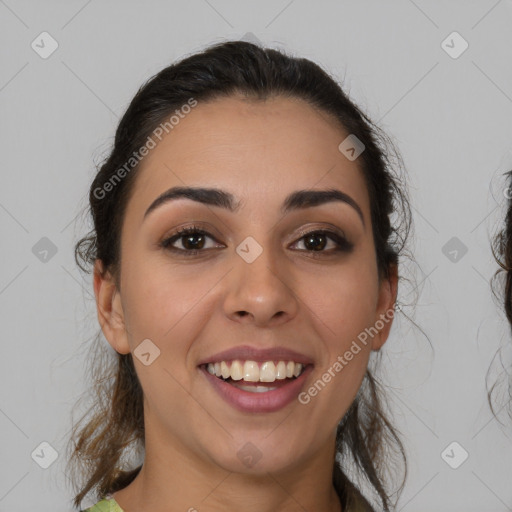 Joyful latino young-adult female with medium  brown hair and brown eyes