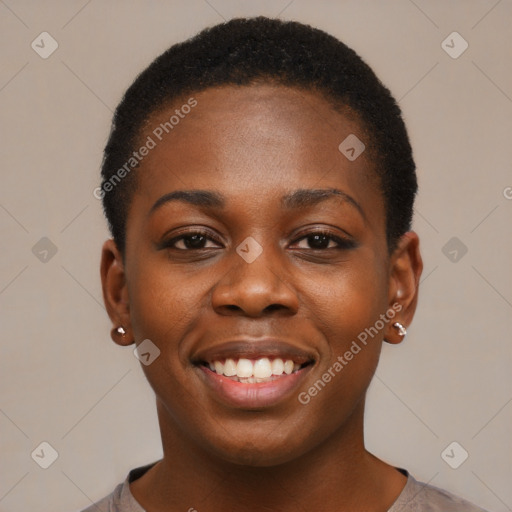 Joyful black young-adult female with short  black hair and brown eyes