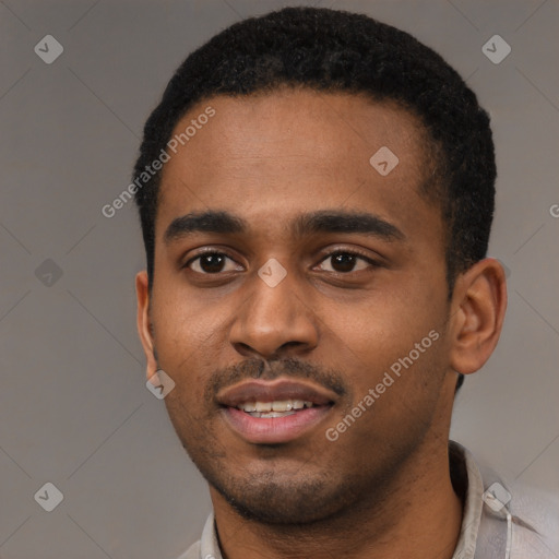 Joyful black young-adult male with short  black hair and brown eyes