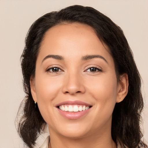 Joyful white young-adult female with medium  brown hair and brown eyes