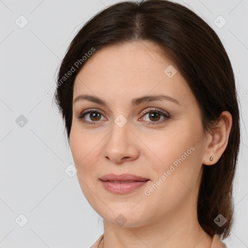 Joyful white young-adult female with medium  brown hair and brown eyes