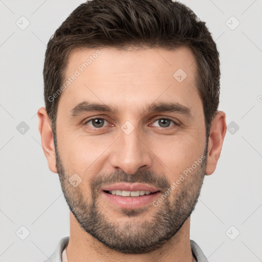 Joyful white young-adult male with short  brown hair and brown eyes