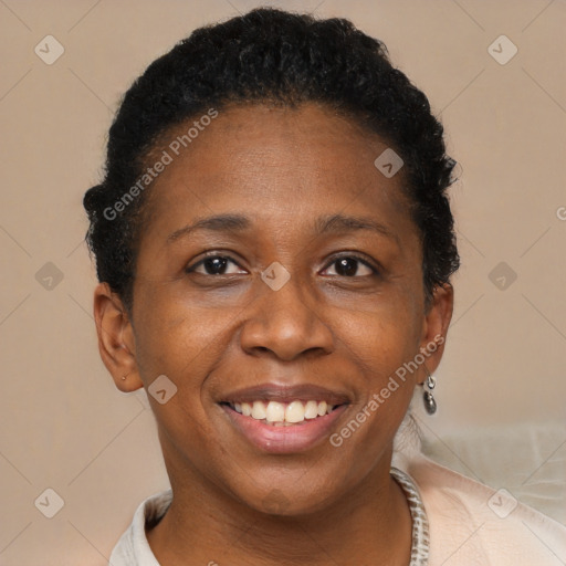 Joyful black adult female with short  brown hair and brown eyes