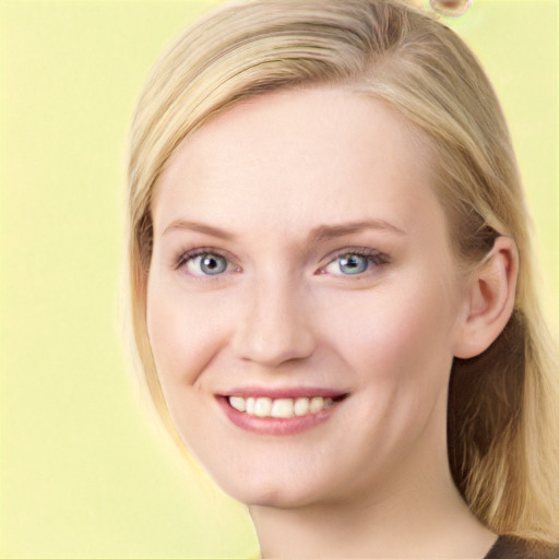 Joyful white young-adult female with long  brown hair and blue eyes