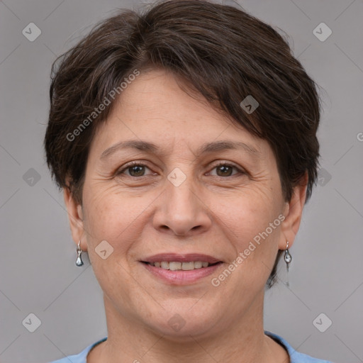 Joyful white adult female with short  brown hair and brown eyes