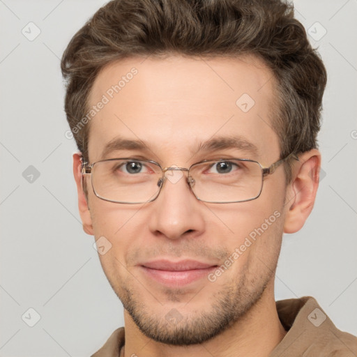 Joyful white adult male with short  brown hair and grey eyes