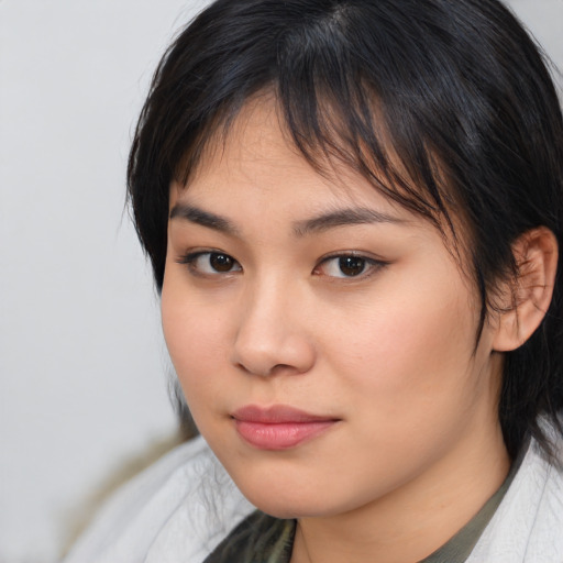 Neutral asian young-adult female with medium  brown hair and brown eyes
