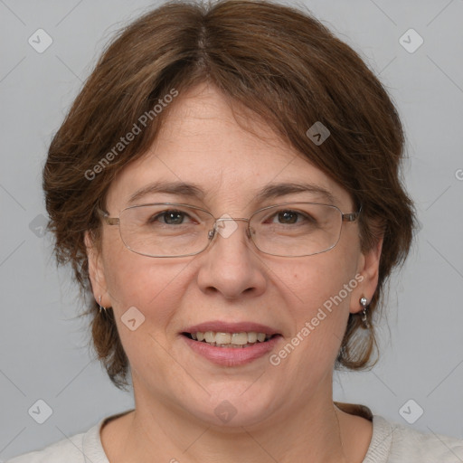 Joyful white adult female with medium  brown hair and blue eyes