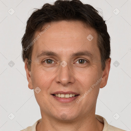 Joyful white adult male with short  brown hair and brown eyes