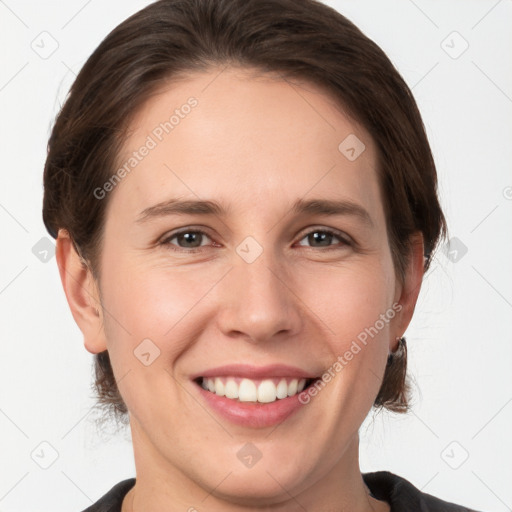 Joyful white young-adult female with medium  brown hair and grey eyes