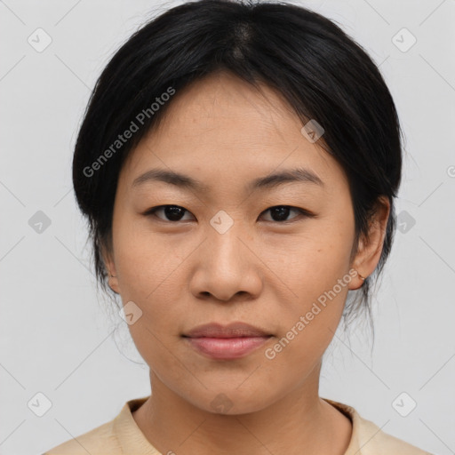 Joyful asian young-adult female with medium  black hair and brown eyes