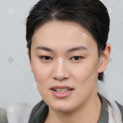 Joyful asian young-adult female with short  brown hair and brown eyes