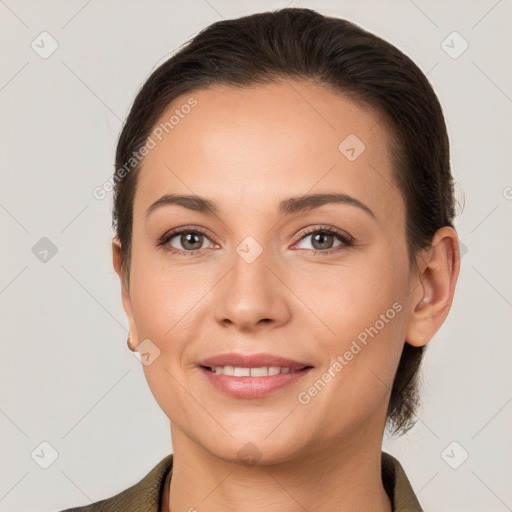 Joyful white young-adult female with short  brown hair and brown eyes